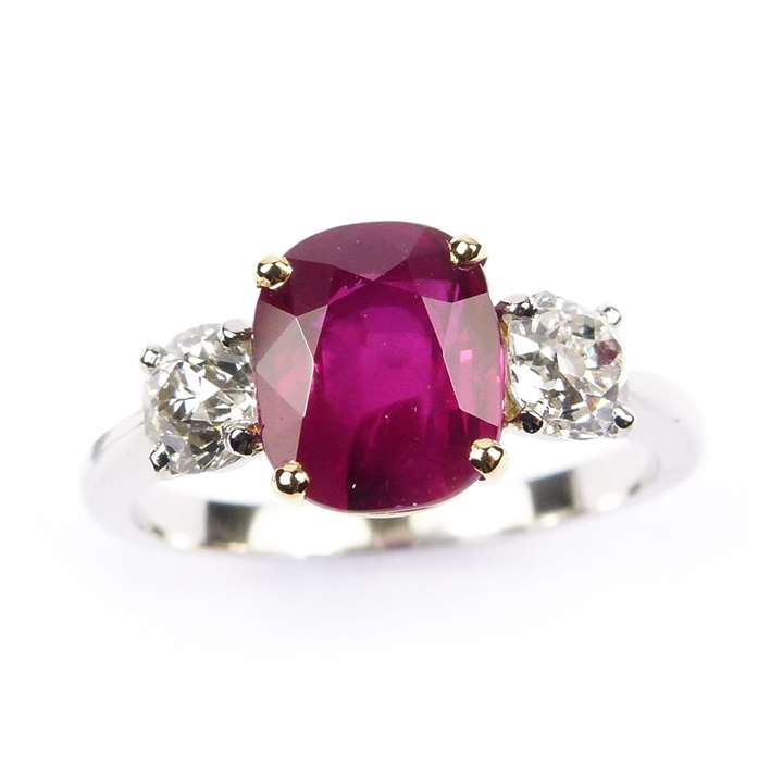 Ruby and diamond three stone ring, claw set with a cushion cut 2.52ct Burma ruby,